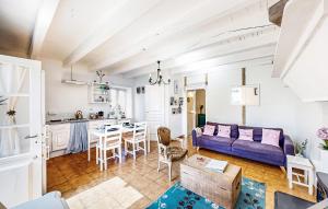 a living room with a couch and a table at Lovely Home In Oradour-Fanais With Wifi in Oradour-Fanais