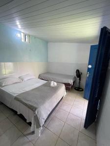Postel nebo postele na pokoji v ubytování Pousada Bê kite cauipe