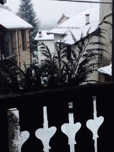 a view from a window of a house with snow at La Maison Lion in Marsiai