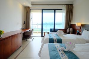 Huizhou Hazens East Bay Resort客房内的一张或多张床位