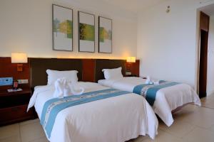 Huizhou Hazens East Bay Resort客房内的一张或多张床位
