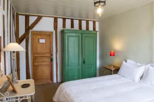 Postel nebo postele na pokoji v ubytování Maison de Mézos