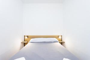 En eller flere senge i et værelse på El mirador de Angeles