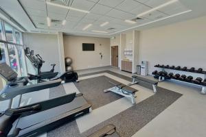 a gym with two treadmills and two exercise bikes at Fairfield by Marriott San Jose Airport Alajuela in Alajuela City