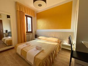 Postel nebo postele na pokoji v ubytování Hotel Sirena