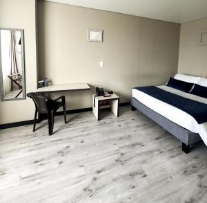 Postel nebo postele na pokoji v ubytování Hotel WLH Silver Corferias + 37 fotografií