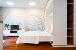 En eller flere senge i et værelse på Urban Jungle