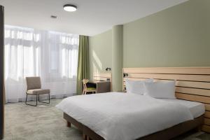 Llit o llits en una habitació de flexymotel Buchs