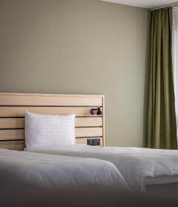 Llit o llits en una habitació de flexymotel Buchs