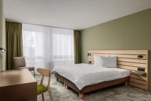 Llit o llits en una habitació de flexymotel Buchs