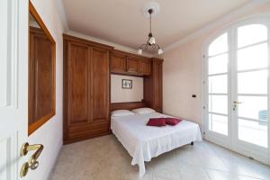 Säng eller sängar i ett rum på La Ripostiera by BarbarHouse