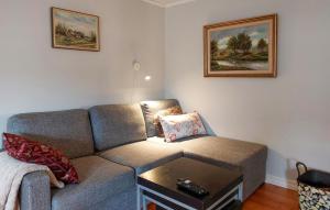 a living room with a couch and a table at Gorgeous Home In Ullared With Sauna in Ullared