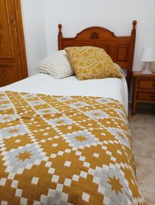 Postel nebo postele na pokoji v ubytování Hostal San José Naval