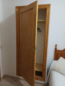 Postel nebo postele na pokoji v ubytování Hostal San José Naval