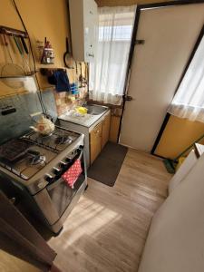 an overhead view of a kitchen with a stove at CasaNancy in Panguipulli +4 photos