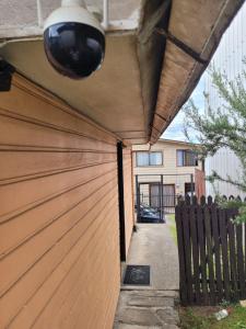 a wooden garage door with a fence in front of a house at CasaNancy in Panguipulli