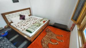 Postel nebo postele na pokoji v ubytování Mountain Bliss - 2BHK Apartment