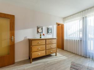 a bedroom with a dresser and a window at Ferienwohnanlage-Oberaudorf 1 Zimmer App E 8 mit Hallenbad und Sauna in Oberaudorf +15 photos