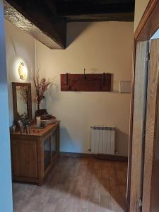 a room with a vanity and a mirror on the wall at Casa Erro Zapatainea - Refugio y Naturaleza in Erro