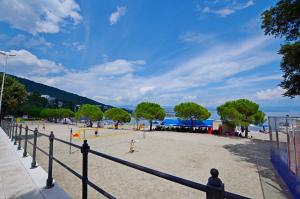 a group of people playing volley ball on a beach at Apartment Elza in Ičići