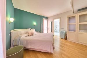 Ένα ή περισσότερα κρεβάτια σε δωμάτιο στο Hotel Belvedere Ranco