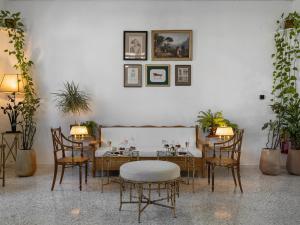 A seating area at Caramel, A Grecotel Resort to Live