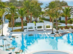 The swimming pool at or close to Caramel, A Grecotel Resort to Live
