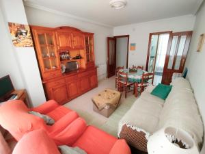 a living room with a couch and a table at Vivienda Maceda in Maceda