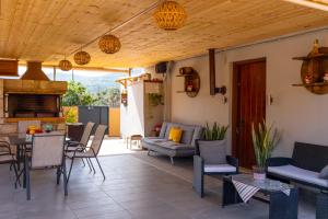 a patio with furniture and a table and chairs at Countryhouse Villa with pool & private parking in Heraklio Town