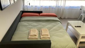 Posteľ alebo postele v izbe v ubytovaní Apartamentos Vernia 4-15