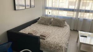 Posteľ alebo postele v izbe v ubytovaní Apartamentos Vernia 4-15 + 25 fotografií