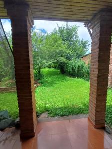a view of a garden from an open patio at Cabaña Del Jardín San Pedro De Colalao in San Pedro de Colalao