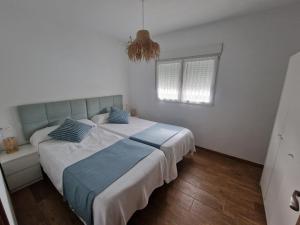 Postel nebo postele na pokoji v ubytování vv85 vivienda vacacional casa tames