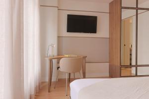 Ένα ή περισσότερα κρεβάτια σε δωμάτιο στο Hotel Hill House Usaquén