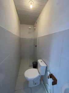 a bathroom with a toilet and a sink at Pousada Bê kite cauipe in Caucaia