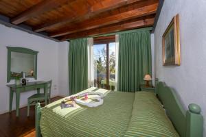 Ένα ή περισσότερα κρεβάτια σε δωμάτιο στο Liano Apartments