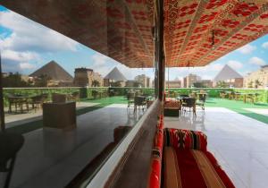 a view of the pyramids from inside a bus at Giza Pyramids view hotel in Giza