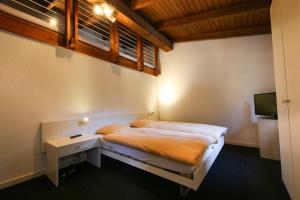 Voodi või voodid majutusasutuse Hotel Grüsch toas
