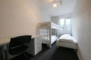 Voodi või voodid majutusasutuse Hotel Grüsch toas