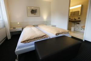 Voodi või voodid majutusasutuse Hotel Grüsch toas