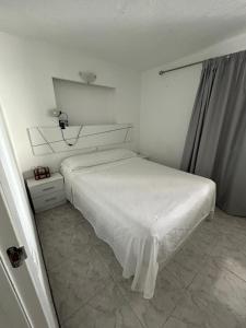 Ένα ή περισσότερα κρεβάτια σε δωμάτιο στο Apartamento Benidorm primera linea