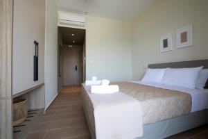 Postel nebo postele na pokoji v ubytování Trinasus Hotel + 37 fotografií
