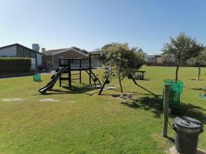 a park with a playground with a slide at VanZylsRus in Pearly Beach