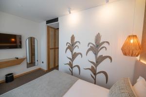 Ein Bett oder Betten in einem Zimmer der Unterkunft Favaios Aldeia Resort - Casa das Padeiras