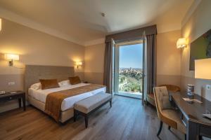 Posteľ alebo postele v izbe v ubytovaní Hotel Palazzo San Lorenzo & Spa