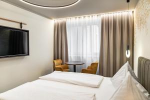 Postel nebo postele na pokoji v ubytování Hotel Lokomotive