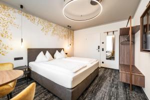 Postel nebo postele na pokoji v ubytování Hotel Lokomotive