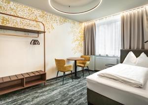 Postel nebo postele na pokoji v ubytování Hotel Lokomotive