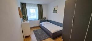 Postel nebo postele na pokoji v ubytování Ferienwohnung Wallersee