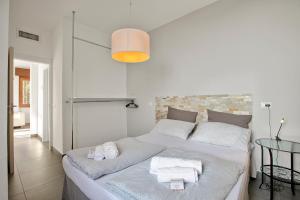 Posteľ alebo postele v izbe v ubytovaní Casa dei Nonni Apartments